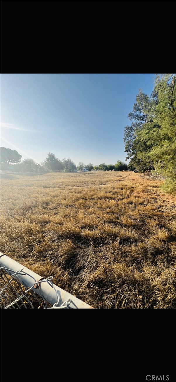 Welcome to 29390 Gretchen Lane, A rare opportunity to own 1.25 acres of flat, usable land located in the fast-growing city of Menifee. This expansive vacant lot offers endless possibilities—whether you're looking to build your dream home, establish a horse property, or invest in future development. It's Nestled on a quiet, rural street, the parcel offers a peaceful setting with beautiful views of the surrounding hills, yet it’s just minutes from shopping, schools, and freeway access. Utilities are nearby, and the lot offers plenty of space for a custom home, workshop, RVs, or even a small farm or orchard.