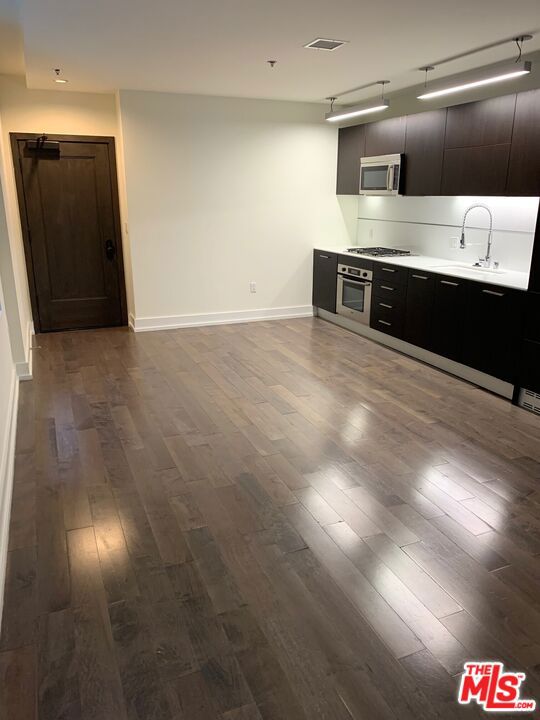 #701 is a two-story unit with a view of the courtyard facing west. "Look and Lease Special." Take up to EIGHT weeks FREE rent on our exclusive move-in promotion. 4 weeks free, 4 weeks on 'Look and Lease" for total of 8 weeks free. Offer subject to change without notice, prices change weekly, book your appointment ASAP and ask for details on this promotion. Welcome to a pet-friendly community offering exceptional comfort and convenience. This bright, spacious loft features soaring ceilings and abundant natural light through large east-facing windows overlooking the serene courtyard. Enjoy premium amenities including: 24/7 fitness center, secure Parcel Pending locker system that notifies you instantly via text of package deliveries to lockers, 24/7 concierge service and valet parking with text retrieval anytime day or night, Bosch brand kitchen appliances: gas range, microwave, dishwasher, and in-unit washer/dryer. Refreshing rooftop pool and hottub, indoor/outdoor lounges with oversized TVs and comfortable seating. Private wine room with lockers and meeting space for gatherings or quiet work. Beautifully furnished guest suite available for residents' visitors, ideal for hosting friends and family. Live in a vibrant neighborhood with Whole Foods, Ralphs, Smart & Final, Target, and Grocery Outlet nearby, plus The Bloc* shopping district is just across the street, featuring Uniqlo, USPS, Alamo Drafthouse Cinema, Drybar, GNC, LaMay Nail Salon, Starbucks, Sheraton Grand Hotel, T-Mobile, Hatch Yakitori, Marugame Udon, Oil + Cream Massage, One Medical, UCLA Health. Building is perfectly positioned above the 7th St/Metro Center station, providing quick access to all subway lines, LA Live, and the LA Convention Center within minutes. Street level of our building is Northern Cafe and Jollibee. Multiple loft options are available in various layouts and price ranges. Prices and lease specials updated weekly. Schedule your tour today to discover luxury, convenience, and peace of mind in one of the most desirable addresses in downtown Los Angeles financial district. Complimentary valet parking while touring.