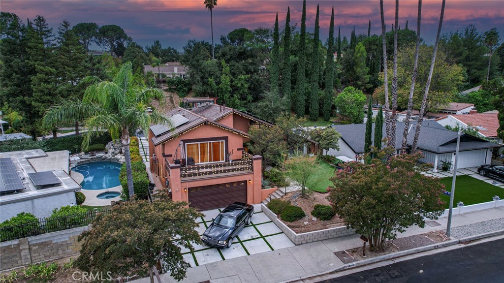 Welcome to this exquisitely remodeled home, featuring paid-off solar energy and breathtaking mountain views, nestled in the heart of Porter Ranch. No detail has been overlooked in this stunning residence.
As you step inside, you’ll be greeted by elegant new tile flooring throughout, complemented by stylish vinyl flooring in all bedrooms. The guest restroom has been tastefully remodeled with all-new tile, while the family room boasts a modern electric fireplace surrounded by Italian tile. The popcorn ceilings have been removed to create an airy, contemporary feel, enhanced by upgraded recessed lighting in the kitchen, three bedrooms, and the family room.
The home also includes an electric car charger for your convenience. A comprehensive water filtration system ensures fresh water throughout the house, and the driveway has been expanded with a fresh layout of artificial grass and a new retaining wall enhancing the curb appeal.
The backyard is a true oasis, featuring a freshly renovated pool with a mini pebble finish (10 ft deep) and new plumbing with three return lines. A cozy Baja shelf has been added for the kids, along with brand-new equipment including a saltwater system, heater, pumps, and a water feature. Enjoy the convenience of wireless pool controls, two color-changing pool lights, a new skimmer, and an auto-fill feature.
Surrounding the pool, you’ll find newly installed cement slabs and elegant tile-work, as well as a barrier wall and new gates for added safety. The patio area features brand-new pavers and lighting, creating an inviting space for relaxation and entertainment.
A newly completed bar area awaits your finishing touches, boasting a custom $12,000 bi-fold window that perfectly frames the stunning views. The newly installed sprinkler system services the hillside and pool area, making this home a luxurious retreat. Bar area also includes quartz countertops, electric stove top, refrigerator, tv, sink and much more!
Experience the perfect blend of sophistication and comfort in this remarkable property!