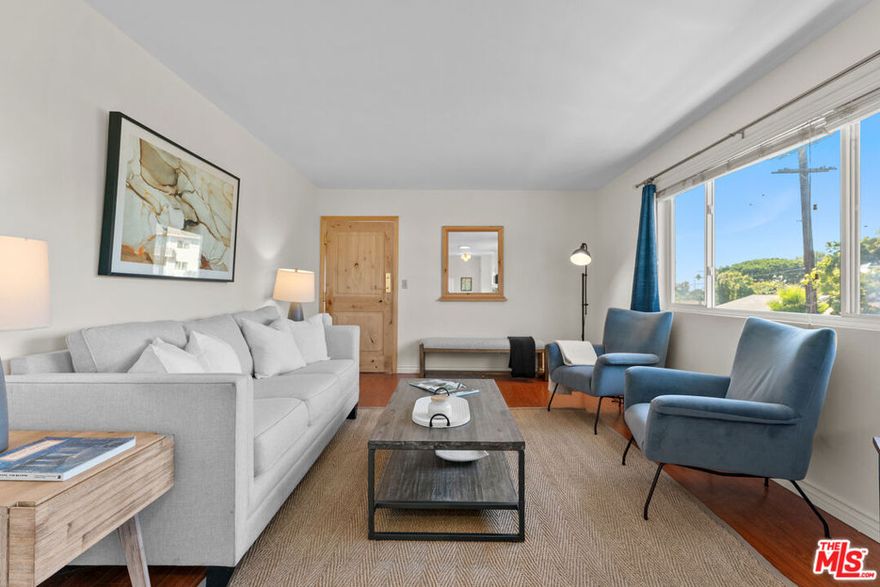 Welcome to 10980 Palms Blvd #5, a beautifully refreshed and move-in ready 2-bedroom, 2-bathroom residence located in a quiet, well-kept 8-unit building in the heart of one of West LA's most desirable and centrally located neighborhoods. This bright and inviting top-floor unit has just been freshly painted and thoughtfully updated, offering a clean, modern feel that perfectly balances comfort and convenience. With only one shared wall, this home provides a rare sense of privacy and tranquility, complemented by abundant natural light and an airy open-concept layout that flows effortlessly between the living, dining, and kitchen areasideal for both everyday living and entertaining.The spacious primary suite serves as a peaceful retreat, featuring its own en-suite bathroom and a large walk-in closet, providing ample storage and a touch of luxury. The second bedroom is equally versatileperfect for guests, a home office, or a creative space. Both bathrooms have been tastefully refreshed, and the in-unit washer and dryer add everyday ease. The kitchen offers generous cabinetry and counter space, ready for home-cooked meals or quick bites before heading out to enjoy everything the neighborhood has to offer. Practical touches elevate the comfort of this home, including two assigned parking spaces and extra storage, making city living both convenient and organized. Tucked away in a small, intimate building with only eight units, the property offers a quiet, community-oriented living experience with the low-maintenance benefits of condo ownership. Situated on a charming residential street, it's just moments from local cafes, shops, grocery stores, and restaurants, as well as downtown Culver City, the Expo Line, and major employers like Sony and Apple's LA campus. With quick access to the 10 and 405 freeways, commuting to Santa Monica, DTLA, or the South Bay is effortless. Whether you're settling into your first home or seeking a stylish and serene space in one of LA's most connected neighborhoods, this residence offers the perfect combination of comfort, privacy, and convenience. Experience the best of Westside living at 10980 Palms Blvd #5, a top-floor gem that truly feels like home.