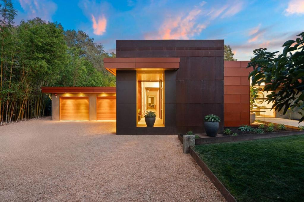 680 Ringwood Avenue is a sophisticated, bespoke modern residence with a separate 535 SqFt. ADU in the exclusive Menlo Oaks neighborhood of Menlo Park, on the Atherton border. Designed by renowned SF architect, William Duff, who incorporated environmentally-conscious materials, this stunning home showcases the fluidity of open spaces and radiates elegance, understated luxury, and exceptional comfort in a one-of-a-kind and environmentally-conscious modern dwelling. Sumptuous design aspects elevate grand spaces with floor-to-ceiling windows that bathe rooms in natural light imparting a warm and lavish, yet relaxed aesthetic. The family room with 14-ft. ceilings, operable clerestory windows and full-wall Solarlux accordion glass doors accentuate seamless indoor-outdoor living, making it an ideal space for easy daily living or special festivities. Retreat and relax in stylish comfort in the spacious bedrooms and soothing spa-like bathrooms. Bask in the warmth of the California sun on the sprawling .63-acre resort-like grounds complete with ADU, rectangular heated pool, prolific fruit trees, and majestic Oak trees. Live in a peaceful sanctuary in prestigious Menlo Oaks surrounded harmoniously by nature, tranquility and privacy at the height of modern, luxurious living.