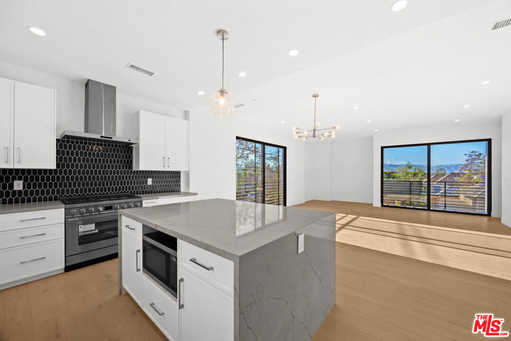 **3 BEDROOM + OFFICE + 2.5 BATHROOM + ELEVATOR + PRIVATE ROOFTOP DECK & 2 CAR GARAGE! PRIME LOCATION! CENTRAL A/C, WASHER/DRYER IN-UNIT, PET FRIENDLY** Experience modern luxury in this brand new townhome that blends sophisticated design, open-concept living, and unbeatable city views. Featuring 3 spacious bedrooms and 2.5 elegant bathrooms, this home is thoughtfully crafted for both comfort and style. Soaring ceilings, oversized windows, and premium finishes create a bright and inviting atmosphere throughout. Enjoy seamless indoor-outdoor living with a private rooftop deck offering sweeping panoramic views perfect for entertaining, relaxing, or watching the sunset. Additional highlights include a full-size in-unit washer/dryer, central A/C and heat, and a private 2-car garage with direct access. Nestled in a prime location near the vibrant heart of Los Angeles, you'll have easy access to top dining, shopping, and entertainment destinations. Whether you're hosting guests on the rooftop, exploring the neighborhood, or enjoying the tranquility of your new space, this home offers the best of city living. Pet-friendly and newly constructedthis is more than just a rental, it's your next home. Schedule a showing today! *Photos may vary.*