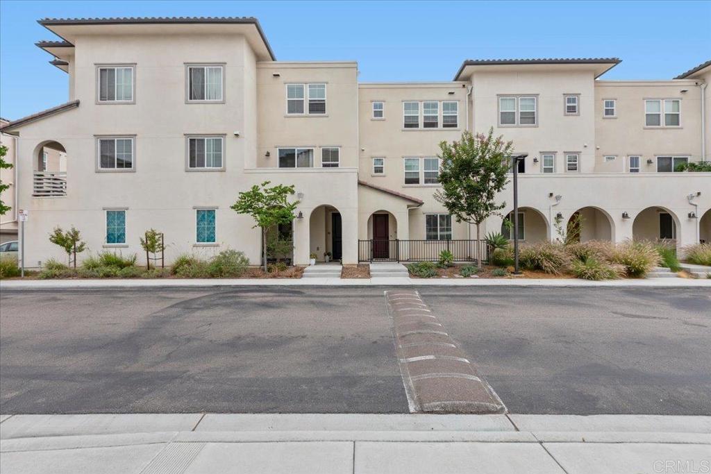 ***VA ASSUMABLE LOAN*** 5.625% Luxurious Townhome in the Playa Del Sol Community, this stunning 4-bedroom townhome offers the perfect blend of modern living and comfort. With 3.5 bathrooms and an optional office nook, this home provides ample space for work, relaxation, and entertaining, plus a 2-car garage for added convenience. The open-concept layout features a spacious kitchen with a center island, sleek shaker-style cabinetry, and elegant quartz countertops. High-end stainless steel appliances—including a gas stove, microwave, refrigerator, and dishwasher—complete this chef’s dream kitchen. A bedroom and full bath on the first floor provide privacy and flexibility, making it ideal for guests or multi-generational living. Throughout the home, luxury vinyl plank flooring adds a touch of modern sophistication to the light-filled rooms. The expansive primary bedroom suite offers a private retreat, featuring a spacious walk-in closet and an ensuite bath for ultimate comfort. Step outside to your front patio or unwind on the balcony to enjoy the beautiful surroundings. Living in Playa Del Sol means enjoying resort-style amenities right at your doorstep. The gated community boasts a clubhouse, heated pool, jacuzzi, children's splash pool, fitness center, playground, dog park, and more. The high-end recreation center includes a gym, swim club, spa, outdoor BBQ area, rooftop lounge, indoor kitchen, and a clubhouse for social gatherings. Located in the master-planned community of Ocean View Hills, Playa Del Sol is surrounded by exceptional schools and parks, including Ocean View Hills Elementary and the 15-acre Cesar Solis Community Park, with sports fields, playgrounds, picnic areas, and more. With convenient access to freeways, shopping, dining, and bike trails, plus downtown San Diego just 15 minutes away, this home truly offers the perfect balance of luxury, convenience, and lifestyle.