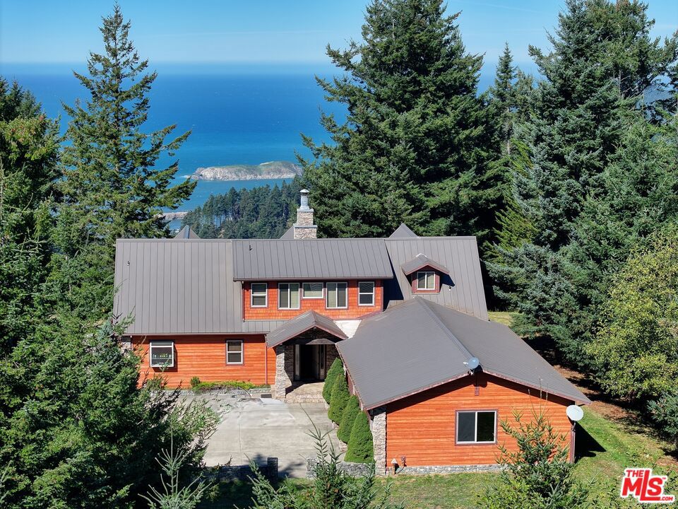 EXQUISITE PISTOL RIVER OCEAN VIEW ESTATE FOR THOSE WITH DISTINCTIVE TASTE! Incredible opportunity to own this private retreat. Embrace the freedom and breathe in the beauty of this coastal land spreading over three tax lots covering 354 acres. The oasis is located above the pristine beaches of Pistol River. This exceptional coastal retreat seamlessly combines beauty, tranquility, and adventure. Sellers have significantly improved the property's infrastructure with a stunning ocean view Custom Home professionally decorated with 4 bedrooms, 3 baths, 3,508 sq ft, being sold fully furnished. Complementing the home is an ocean view 900 sq ft porch, a 2,070 sq ft garage with generator and cement bunker, and 7,500-gallon water tanks. There is a 110-mph wind shear on the structure of the house to comfortably handle storms. The estate includes a 1,265 sq ft 1-bedroom, 1 bath Caretaker's Cottage with a garage offering ocean views from the living room and a large deck. Additional improvements are miles of ATV trails, manicured roads, 2 fishing ponds, one with bear tree carving, rifle range, three barns with equipment to maintain the estate and house the fishing boats, RV's and more, 600-gallon propane tanks, 3,000-gallon septic, 5 drilled wells, and a cell tower lease with 15 years remaining. Whether relaxing in your hot tub, discovering the rock formations, walking the sandy beach, finding treasures in the tidepools at the water's edge, riding your ATV on miles of trails, or witnessing the stunning sunsets, this is the ultimate Oregon Coast experience where forest, valley, and the Pacific Ocean merge! Included are architectural plans for a 13,000 sq ft main home with a 5,000-gallon water tank. Too many improvements to list. Additional homesites are cleared. Buyer to do due diligence with the county for permits. Privacy, freedom, restfulness, elegance, and joy are only some of the words describing this Estate! The owner will carry with 30% down. Prequalified buyers only.