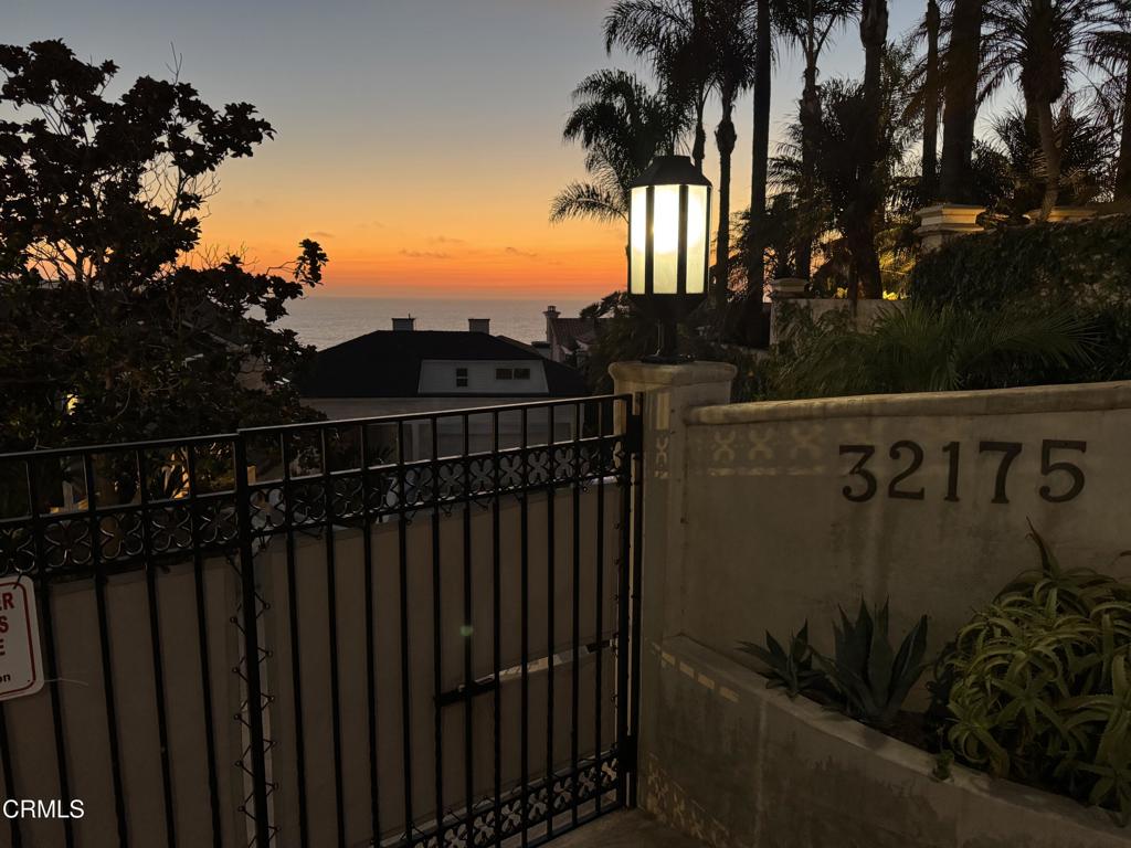 Discover this stunning beach estate in South Laguna behind gates with gorgeous vistas to Catalina and up and down the coast line. The home has architectural interest with open air beam ceilings and large windows. There are beautiful new refinished hard wood floors throughout, in pristine condition. New California Custom Deluxe windows throughout and new California Custom Deluxe glass patio doors. The Den on the main floor could be used as a 4th bedroom/guest room with attached 3/4 bath. The kitchen is open to a breakfast room with a wall of glass to the ocean views. The laundry room is attached to the kitchen. The Main Bedroom is on the lowest level with a walk in closet and an open separate office attached with doors to a patio overlooking the ocean. The 2 additional bedroom suites are on the upstairs level. One upstairs bedroom has a side balcony and outside storage closet area. There is a large covered deck outside the living room overlooking the ocean. The Fireplace in the living room has gas logs. This is a very special property.