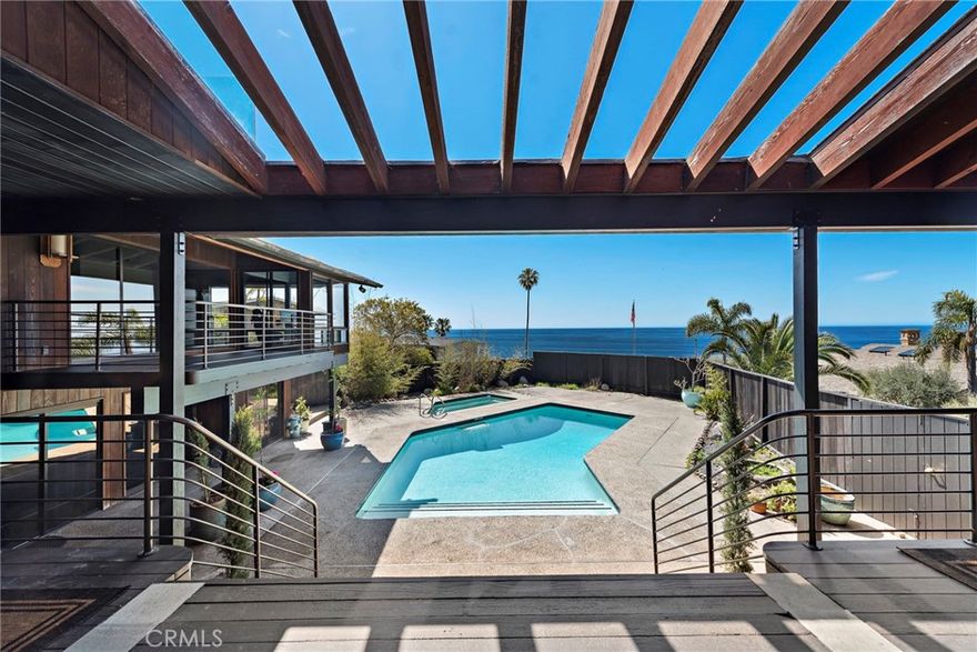 Introducing the Crown Jewel of Mystic Hills, a truly exceptional property that epitomizes elegance and potential, nestled in one of California's most coveted locations. Encompassing nearly 7,000 square feet of luxurious living space, this home is situated on a rare, expansive 18,000 square foot lot (approx), offering breathtaking 180-degree panoramic views of the mesmerizing whitewater ocean and the charming panorama of downtown Laguna. This property is not only a stunning residence but also an unparalleled investment opportunity, with potential for lot subdivision, making it ideal for investors or those seeking a multi-generational family compound.



With its convenient location, this magnificent home offers walking distance access to downtown attractions, the high school, pristine beaches, and renowned art festivals, thus combining seclusion with accessibility. Established as one of the first developed parcels in Mystic Hills and cherished by the same family since 1947, this property is imbued with a rich history and a one-of-a-kind charm, offering a rare opportunity to own a piece of local heritage.



Positioned on a prominent corner lot, the estate boasts potential for subdivision, which further enhances its appeal as a versatile investment. This expansive home features five inviting bedrooms and four and a half elegantly designed bathrooms, ensuring ample space for comfort and sophistication.



Adding to the allure of this stunning home are five cozy fireplaces that elevate the ambiance, creating a warm and inviting atmosphere. Outside, the property offers a lavish pool and spa, perfect for entertaining or unwinding with serene views and a gentle coastal breeze. The rare combination of luxurious amenities and unbeatable location makes this estate an extraordinary find that promises to captivate discerning buyers quickly. Don't miss the chance to call this remarkable property your own; it is truly an opportunity not to be missed.