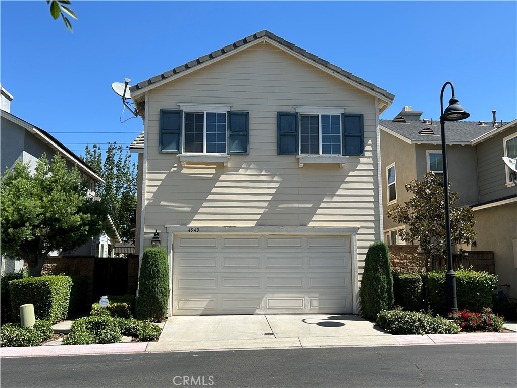 Stunning detached home in the highly desirable Liberty Square Gated Community with its basketball courts and playgrounds, close to schools, shopping, and freeways. This gem boasts a light and bright living room with a cozy gas fireplace, dining area is open to the kitchen with oak cabinets, brand new wood floor, recessed lighting. Upstairs you will find a built in desk, master bedroom with a walk in closet, along with 2 additional good size bedrooms.