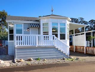 NEW PRICE !! This Immaculate 10-year old double-wide features a large open living room, separate dining area, large kitchen, two bedrooms, two baths, laundry room, and a bonus room which could be a third bedroom (w/out closet), or an office, den, or media room. Situated on a quiet street at the rear of the park. The property backs up to trees, a rural area beyond, and there are lovely views of distant hills from the front porch. There is a separate shed/workshop on concrete foundation at the end of the driveway. Large concrete patio at the rear provides ample room for both outdoor entertaining and container gardening. The interior of this quality home is filled with bright light from numerous windows and skylights, and the kitchen contains first-class appliances, including a microwave oven, gas range, refrigerator and dishwasher. This is easy living ! Drop into the clubhouse for morning coffee or later enjoy the pool. Close to 41st Avenue, shopping, beaches, two hospitals and bus service to downtown. . This spacious home is like-new in every detail, and ready to move into.