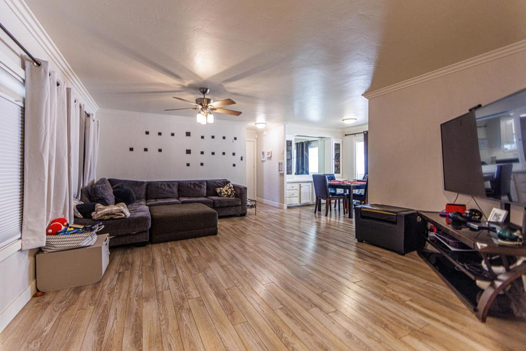 Welcome to Portola Palms in Palm Desert--an inviting community located directly across from Abraham Elementary School, complete with a pool, spa, and clubhouse for residents to enjoy. This manufactured home is set on a permanent foundation, and you own the land--with no age restrictions, making it ideal for families, retirees, or investors. The home features 3 bedrooms and 2 full bathrooms, including a spacious primary suite with a walk-in closet and a dual-sink vanity. Inside, you'll find a comfortable living room, formal dining area, and a cozy kitchen nook with stainless steel appliances. Manufactured wood flooring runs throughout the main living areas, adding warmth and style. Step outside to a covered side porch and fenced area--perfect for kids and pets to play safely. With low HOA dues that include trash and sewer, this is a fantastic opportunity for affordable homeownership in the heart of Palm Desert. A smart starter home or a solid investment!