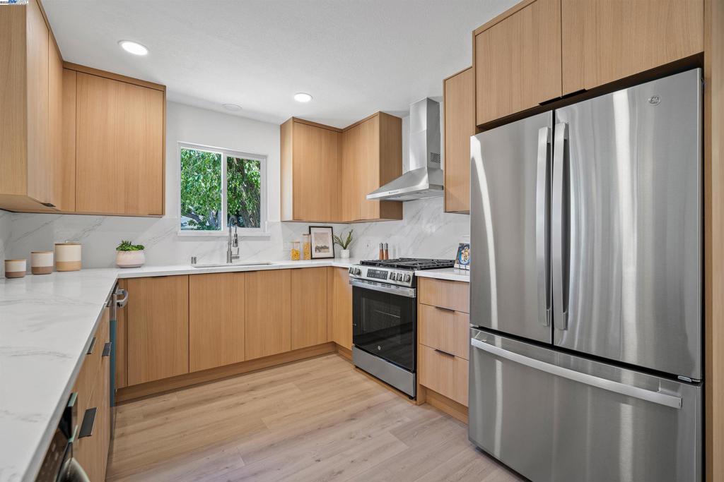 Welcome to 824 14th Avenue—a beautifully remodeled Menlo Park gem designed for comfort, style, and versatility. Nestled on a quiet, charming street with no back neighbors, this home blends privacy and suburban tranquility with unbeatable Silicon Valley convenience. The main house offers 3 bedrooms, 2 bathrooms, and 1,290 sqft of sun-filled living space. A luxury chef’s kitchen with custom cabinetry, high-end stainless steel appliances, and a cozy built-in breakfast nook anchors an open layout that flows effortlessly to the dining and family areas—perfect for entertaining or relaxing at home. The detached 680 sqft ADU features 1 bedroom, 1 bathroom, a full kitchen, independent entry, and its own separate driveway, offering the ultimate flexibility as a private guest suite, executive home office, rental income unit, or independent space for extended family—all while maintaining privacy from the main home. Additional highlights include a rare XL-size 2-car detached garage, new landscaping, and premium finishes throughout. Close to Meta, Google, Stanford, and top-rated schools, this property is the perfect blend of comfort, privacy, and location.