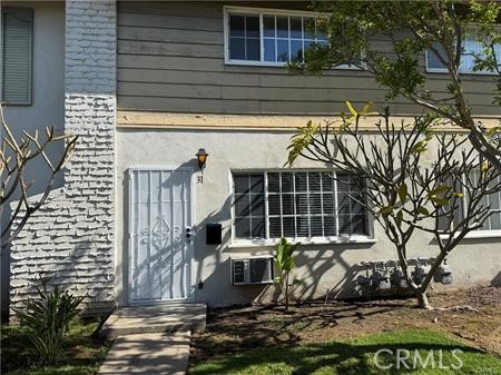 Moving in ready!!!! Brand new front doors and new wood flooring in Two bedrooms and stairway. Nice 2 story condominium for start home or investment. Spacious living room which boasts natural light, cozy kitchen that opens out to the dinning area. There is a half a bath conveniently located downstairs. Sliding door leads out the private patio which is a good size to enjoy a bbq with friends and family. All bedrooms are situated on the second floor. Attached single car garage and assigned parking lot #31. Community features a nice pool which is fenced, well manicured grounds, clean walkways, and laundry rooms. Property is located within near distance to Shopping Centers, Restaurants and schools. Easy access to Freeways.
