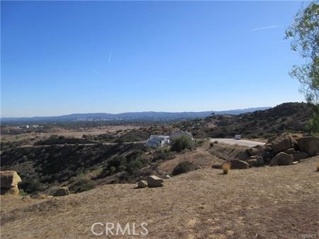Spectacular view lot - unobstructed views of the San Fernando Valley. Light agricultural zoning, all utilities underground and on lot. Seasonal spring on the property. Sewer is in with first time usage fee paid. House plans for 5000sf home. Lot is 50% cut/50% fill.