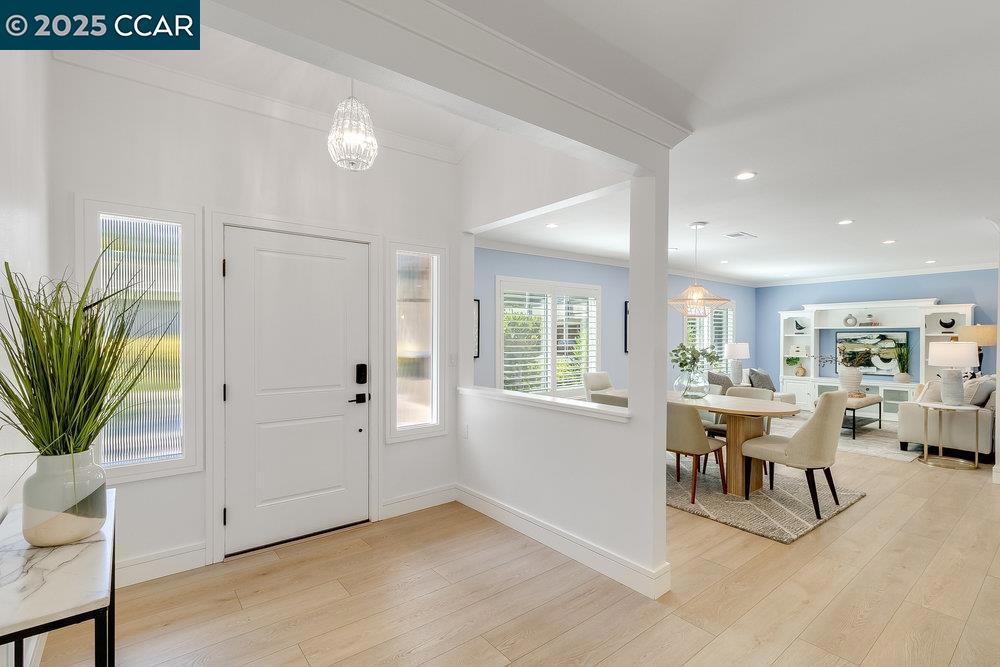 Light, Bright & Beautifully Updated Yosemite Model in Rossmoor! Welcome to 1517 Rockledge Lane, Unit #2 — a sun-drenched, level-in unit that perfectly blends modern updates with comfortable living in the heart of Walnut Creek’s premier 55+ active adult community. This expanded Yosemite model features a spacious foyer and a fully remodeled modern kitchen with quartz countertops, a large island with bar seating, modern backsplash, induction stove, multiple skylights, and ample storage including pantry space with pull outs and deep drawers—perfect for cooking, entertaining, and everyday ease. Enjoy two beautifully upgraded bathrooms, including a spa-like hall bath oasis and a stunning primary bath with a luxurious soaking tub—a true retreat. The home is filled with natural light and features new windows, plantation shutters, luxury vinyl flooring throughout and serene outlooks from every room. Step outside to a sunny private patio, ideal for morning coffee or quiet afternoons. Additional highlights include newer washer & dryer, carport parking just steps away, and plenty of guest parking for convenience. Don’t miss this move-in ready gem with all the upgrades you’ve been looking for—come experience the Rossmoor lifestyle today where you can enjoy pickleball, tennis, golf & more