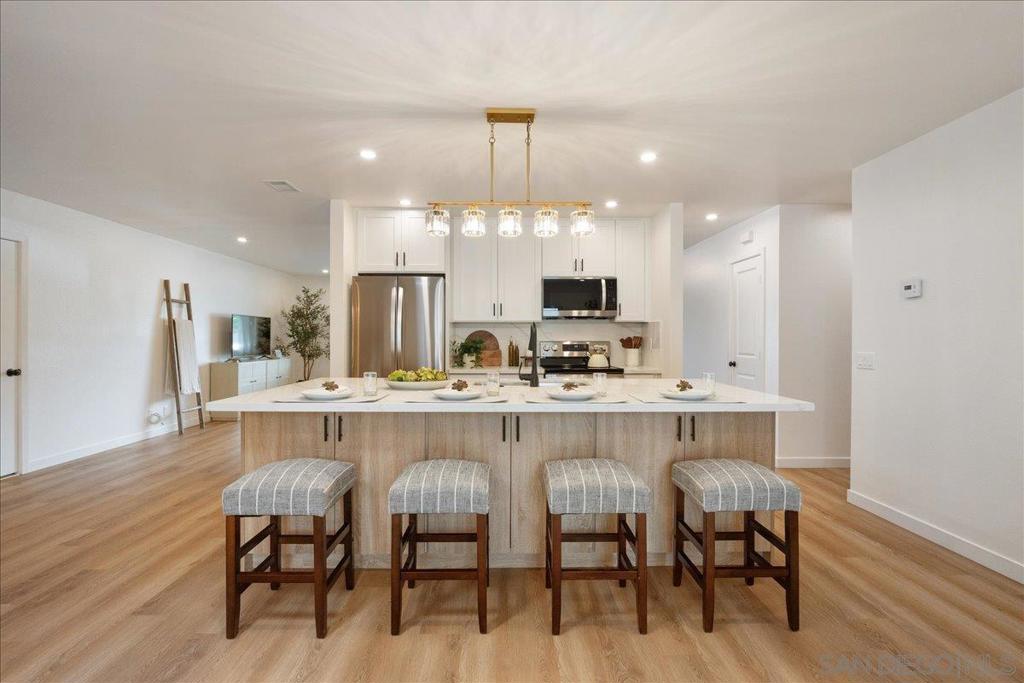 Single-story solar home in a prime location on a quiet cul-de-sac, close to great shopping, freeways, schools, and within walking distance to the lovely Forgotten Barrel Winery. This home offers a fresh, modern feel with a remodeled kitchen and bathrooms, new luxury vinyl flooring, and new appliances. The kitchen features an eat-in bar, perfect for casual dining or entertaining. The large outdoor area has been updated as well, with cleaned-up grounds, new plants, and a fully repaired irrigation system, including a new drip system for water efficiency. **Dont miss** the large side yard included in the property, offering extra space for gardening, play, or potential outdoor upgrades. The newer roof and solar system add to the home’s value and energy savings. Move-in ready and thoughtfully updated inside and out. Lovely single story home in a great neighborhood. Cul de sac, walking distance to winery and amazing proximity to shops and freeways.