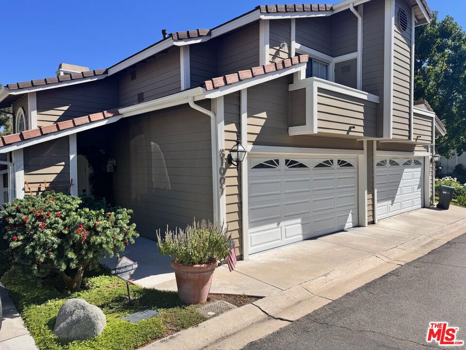 Beautifully upgraded 2 + 2.5 townhome in The Colony, Westlake Village. The kitchen includes granite counters and new appliances. The living room features a custom fireplace and hardwood floors throughout. Upstairs are two spacious bedrooms, each with its own full bathroom and private balcony. Bedrooms are equipped with electric sunblock shades. The primary suite offers an extended sitting area, built-in desk alcove, and a tiled rain shower with custom vanity. Additional features include dual-control, separate-floor Nest A/C systems, Ethernet connectivity throughout, and a renovated garage connected to the central AC system, suitable for office, gym, or additional living space. Outdoor highlights include a private patio and a beautiful garden with an automated electric sprinkler system. The gated community offers a pool, jacuzzi, and tennis courts, located in the desirable Las Virgenes school district.Owner pays HOA dues, tenant pays all utilities, internet,trashservice.