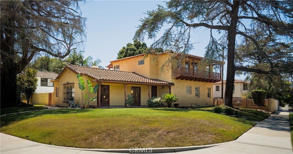 The Greatest Opportunity in Bixby Knolls! Welcome to 4485 Myrtle Avenue, an iconic Spanish-style estate that perfectly blends timeless character with modern living, offering a rare chance to own one of the most coveted properties in the heart of Long Beach’s most sought-after neighborhood. With 6 bedrooms, 4 bathrooms, and 3,563 sq. ft. of beautifully curated space, this home delivers everything today’s buyers are seeking: history, elegance, and a true sense of community. Step inside and be captivated by the sunlit living room, where French doors open to a wraparound veranda and a resort-style backyard. The grand fireplace and arched details evoke the warmth and sophistication of a European villa. A formal dining room, framed by French doors and picture windows, creates the perfect setting for gatherings with friends and family. Your chance to experience the chef’s kitchen and breakfast nook, tastefully remodeled in recent years, marry timeless Spanish charm with contemporary convenience with room to personalize to become your own sanctuary. Downstairs, a versatile bedroom has been reimagined as a cozy family room with a built-in sound system, while upstairs features 6 spacious bedrooms, including a generous primary retreat with serene views. This property is also a dream for those with an adventurous spirit offering 4 garages, including one large enough for a boat or RV. Two upstairs balconies overlook both the peaceful, tree-lined street and the private backyard oasis with a sparkling pool, perfect for year-round entertaining. But what truly sets this home apart is its location in vibrant Bixby Knolls. Top-rated schools, Los Cerritos Elementary School, Longfellow Elementary School, Hughs Middle School to family-friendly parks are just minutes away. Walk to trendy restaurants, artisanal coffee shops, and boutique shopping. Enjoy First Fridays, farmer’s markets, and a lively local art scene. Quick access to major freeways, making LA and Orange County commutes seamless. This is more than a home, it’s an opportunity to join a thriving community where young families are putting down roots, drawn by the charm of historic architecture and the energy of a growing cultural hub. With its blend of character, space, and unbeatable location, 4485 Myrtle Avenue is the lifestyle upgrade you’ve been waiting for.