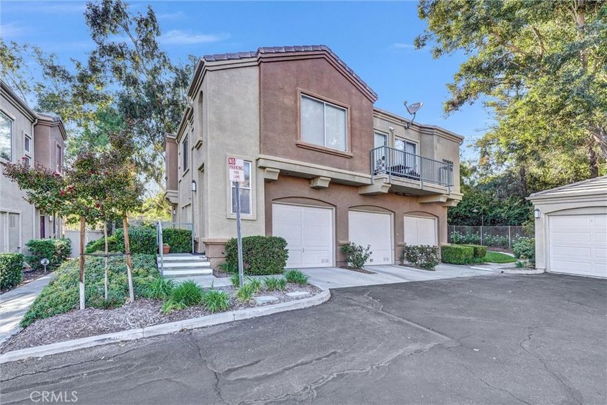 Craving a peaceful tree-lined view while mere moments from city conveniences? This remarkable 2-bedroom, 2-bath townhome in the Rose Arbor Condominiums complex blends an elevated lifestyle with scenic tranquility in Valencia! Resting along a quiet pathway in a rear-unit location, enjoy a sense of privacy and your own leafy prospects of the Paseos.



Inside, soft natural light pours through wide windows across wood-style floors, crisp white walls, and recessed lighting. Its open-concept layout flows from the living room—anchored by a fireplace and built-ins—to the dining area and through to the kitchen, where stainless steel appliances, tiled countertops, and ample cabinetry make cooking feel effortless. Slide open the glass doors to your well-sized patio, perfect for a relaxed brunch or a breezy evening BBQ.



Upstairs, the primary suite offers treetop vistas and an ensuite featuring a dual-sink vanity and a shower/tub combo. A second bedroom and full hall bath complete the upper level. Additional perks include an attached 1-car garage with a laundry corner, plus access to the community pool, spa, and picturesque Valencia Paseo trails just beyond your door.



Near award-winning schools, restaurants, Bridgeport Park, and shopping, along with proximity to the I-5, this home invites you to experience suburban calm with urban benefits. Come see how this amazing abode could signal the start of your new chapter!
