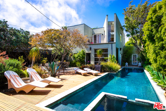Stunning Contemporary Venice Compound With Pool! Cleverly designed by Architect, Mulder Katkov, this simple yet brilliant design commands an industrial minimalist aesthetic, while still encompassing both warmth and comfort. The main living space is comprised of a metal-framed roll-up door that opens to a little oasis: very private and spacious yard with large pool, jacuzzi, & outdoor shower. The entire home is streams with light and has an indoor/outdoor feel. The master bedroom and bathroom suite is generous in size. Conveniently located 5 blocks from Venice Beach, this sleek and sophisticated home is located in heart of everything that makes this city attractive; Abbot Kinney, the Canals, shops, fine dining and interesting galleries. Don't miss this opportunity to live in a masterpiece of profound simplicity!