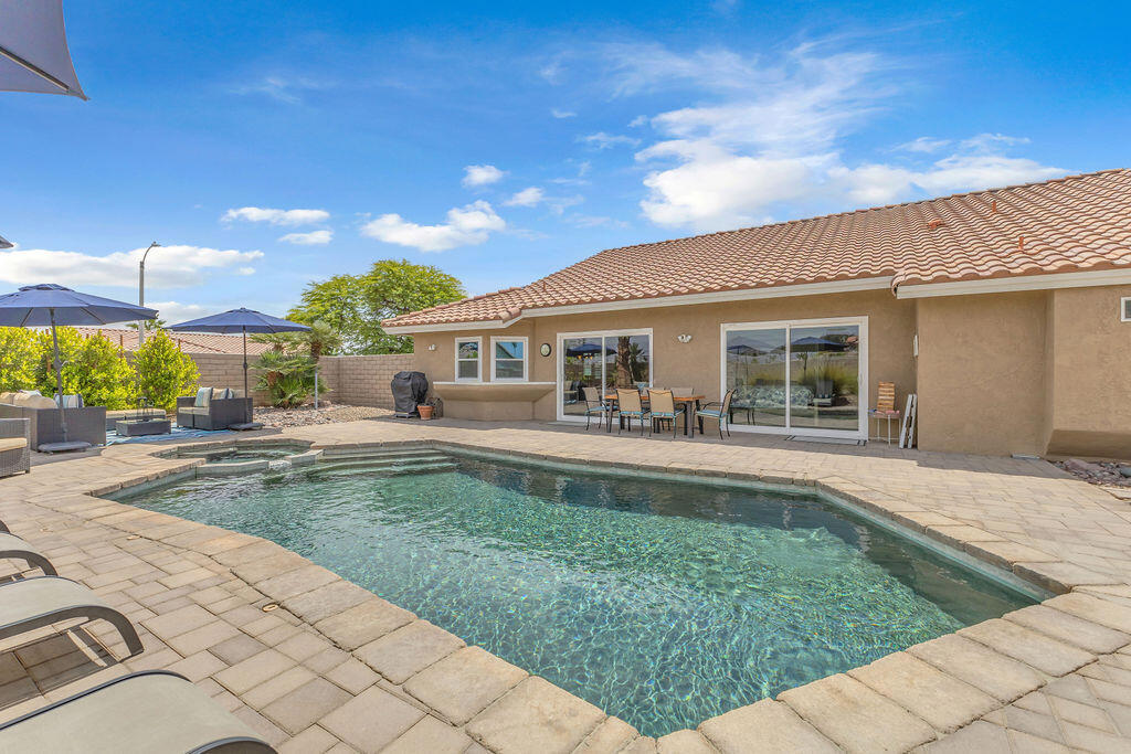 Embrace exceptional living in this beautifully remodeled home perfectly positioned in desirable Indian Wells. This versatile property is ideal as a permanent family residence, low-maintenance seasonal retreat, or lucrative investment with a proven short-term rental history. Thoughtfully redesigned with contemporary elegance, the home showcases upgraded flooring throughout, a stunning new kitchen featuring stylish cabinetry, stainless steel appliances, and a spacious island open to the comfortable family room and inviting outdoor pool area. An elegant living room with a cozy fireplace creates a warm atmosphere ideal for gatherings and entertaining.The primary suite serves as a tranquil retreat, boasting a luxuriously renovated bath complete with an exquisite soaking tub, separate shower, and dual vanity areas. Two well-appointed guest suites provide welcoming spaces for visitors or extended family. Additional property highlights include a three-car garage, energy-efficient solar panels, a new air conditioning system, and freshly painted interiors.As part of the coveted Indian Wells community, owners enjoy exclusive perks including discounted golfing at the renowned Indian Wells Golf Resort, gym access at the Hyatt Hotel, and special rates at local luxury hotels for dining and spa services. Investors will also find this property particularly appealing due to its prime location within easy walking distance to the Indian Wells Tennis Garden, home to the BNP Paribas Tournament, and proximity to the shuttle pick-up for popular music festivals, significantly enhancing its rental potential.