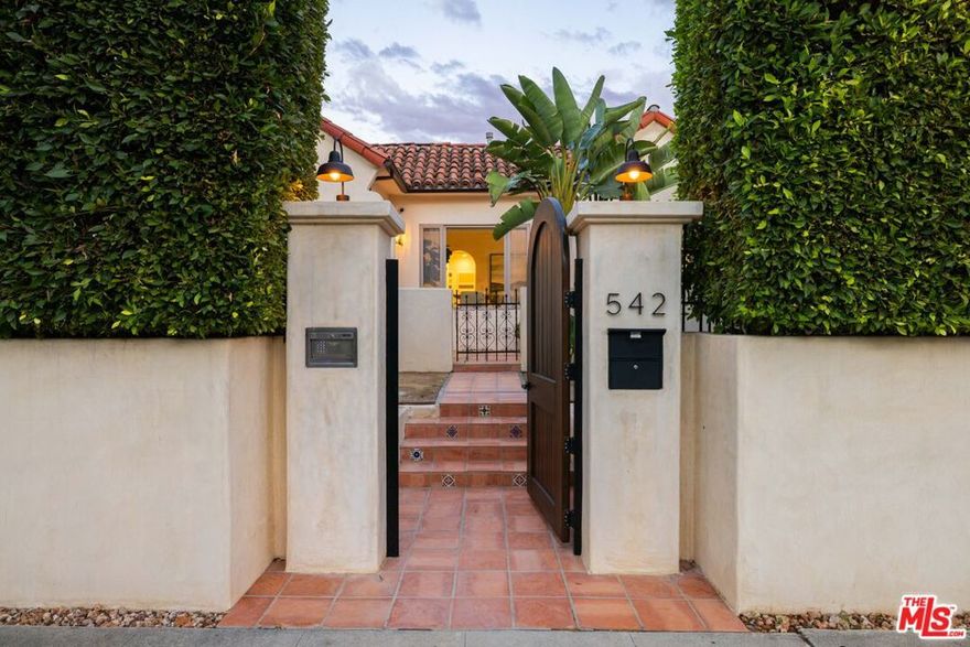 Spanish Revival Gem in Prime Beverly Grove!!!  Welcome to 542 N. Curson Ave., a stunningly remodeled Spanish-style home tucked behind towering privacy hedges in one of Los Angeles' most coveted neighborhoods. Just three blocks north of The Grove, this timeless residence blends old-world charm with modern luxury and unbeatable walkability. The main house features three spacious en-suite bedrooms, each with its own private bath, plus an elegant powder room for guests. The recent renovation includes brand-new hardwood floors, a designer kitchen with custom cabinetry, new countertops, tile backsplash, and premium finishes throughout. Natural light pours in through arched windows, highlighting the authentic Spanish details and airy open floor plan. In the backyard, a fully equipped guest bungalow with its own address offers endless flexibility/perfect as a rental, studio, or guest retreat. It includes a full kitchen, bathroom, living space, and skylights, creating a true private oasis. Step outside to a lush desert-scape garden surrounded by mature succulents, palm trees, and drought-tolerant landscaping that wraps around the property. The backyard is ideal for entertaining or relaxing in total seclusion. Located moments from The Grove, Pan Pacific Park, and some of LA's best dining and shopping, this home offers an exceptional lifestyle. Walk to local favorites like Erwhon, Terroni, Della Terra, Escuela, Open Sesame, Andante Coffee, The Now, Melrose Trading Post, and The Original Farmers Market, or browse nearby boutiques along Melrose and Beverly Boulevard. This is the perfect blend of classic Spanish architecture, modern design, and prime Los Angeles living. A must see and feel-kinda home.