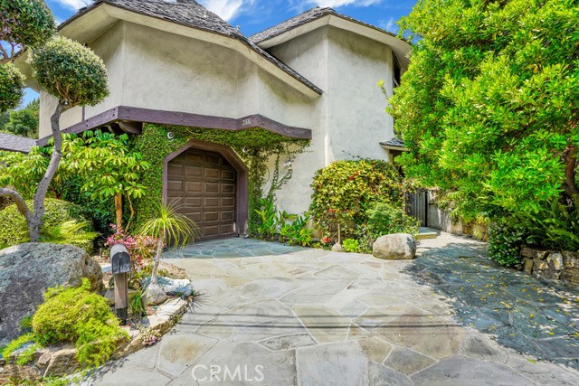 Welcome to your serene escape in the heart of Laguna Beach! Nestled in a tranquil neighborhood, this beautiful 2 en-suites with main level half bath home, offers the perfect blend of comfort and coastal living.
The spacious open-concept living room with its 27’ soaring ceiling is ideal for relaxation and entertaining, featuring large windows that fill the space with natural light and provide picturesque views of the surrounding area.
The modern kitchen is equipped with high-end appliances, ample counter space, and custom cabinetry. Enjoy restful nights in the generously sized en-suites, each designed to be a personal retreat with plenty of closet space. Step outside to a private backyard that offers a peaceful retreat with lush landscaping, perfect for al fresco dining or simply unwinding.
The attached garage houses a full size washer dryer along with ample storage.
This convenient location is situated just minutes from Laguna Beach’s renowned art galleries, shops, dining, and stunning beaches, while also providing easy access to freeways, providing the best of what the area has to offer. This Canyon Acres property is a unique opportunity to experience the unparalleled lifestyle of Laguna Beach.