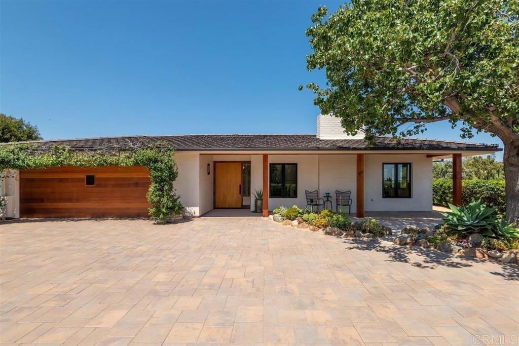 This stunning single-level home boasts a sun-drenched great room, gourmet kitchen, 2 bedroom suites & views of the nearby mountains. Enjoy indoor/outdoor living with private patios & low-maintenance landscaping. Located two blocks from the main town of Rancho Santa Fe. Walk to shops, restaurants & the RSF Inn!