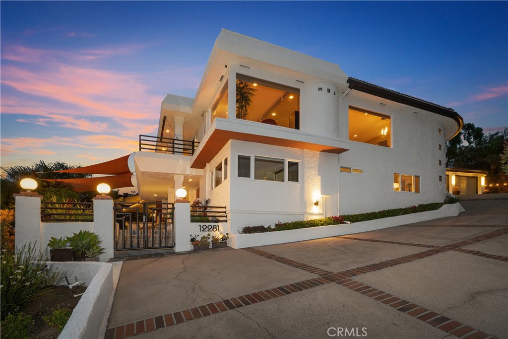 This modern luxury home has a 180-degree city lights view from Catalina to Palos Verdes to the snow capped San Bernardino mountains! Views abound from nearly every room in the house. Upon entry, one passes through a magnificent atrium flooded with natural light and as you look towards the main entertaining area, your eyes immediately focus on walls of glass featuring the panoramic view. Great entertainer's home with a fantastic floorplan that allows for exceptional indoor/outdoor entertaining. Plenty of room to accommodate 6+ cars or a small RV as there is a huge parking area adjacent to the garage. There is also the potential to build a spectacular pool oriented towards the city lights view. The outdoor space is private, mostly flat and includes an outdoor kitchen with beautiful landscaping. High quality upgrades are evident throughout. For the wine connoisseur, there is the potential to store wine in a secret area with a natural rock formation wall. Fantastic schools with approved automatic transfer release from Orange Unified to Tustin Unified schools including: Foothill, Hewes and Arroyo. Centrally located in Orange County (about 40 miles south of Los Angeles), just 30 minutes to Newport Beach and 20 minutes to Orange County Airport.