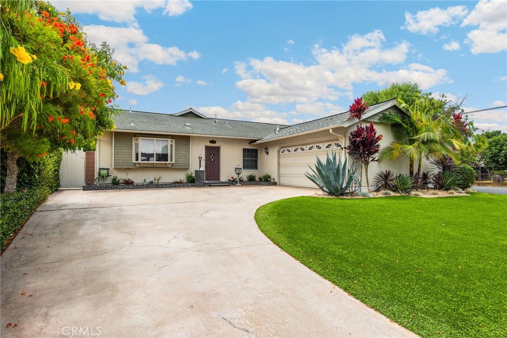 Welcome home to one of Cypress’s most desirable neighborhoods, where tree-lined streets whisper a quiet elegance, stands a home that combined's style, comfort, and convenience.
This 4-bedroom, 2-bath masterpiece offers 1,790 sq. ft. of meticulously cared-for living space, situated on a generous 7,260 sq. ft. corner lot. From the moment you pull into the sweeping driveway, the home’s presence is undeniable with the drought-conscious yet lush landscaping blends vibrant turf with mature landscape in the planters, creating an entrance that’s both sophisticated and welcoming.
Step inside and be embraced by natural light that spills through energy-efficient dual-pane windows, illuminating spaces designed for living beautifully. To your left, the updated kitchen offers a sleek contrast of black appliances against warm cabinetry, ready to host everything from intimate breakfasts to amazing dinner parties.
The dining and living areas flow effortlessly together, anchored by a wood-burning fireplace. This is truly a perfect gathering spot for cool evenings. A custom home office with built-ins, storage, and a murphy bed offers flexibility, easily transforming from workspace to guest retreat.
The primary suite is your private sanctuary, featuring a walk-in closet, ceiling fan, and tranquil primary suite bath. Additional bedrooms and a thoughtfully updated guest bath ensure comfort for family and visitors alike.
Every finish reflects care and intention: Whole-house water purification for pristine living, Ceramic wood flooring in the main areas, plush carpet in bedrooms, Recessed lighting and fresh interior paint, Central air & heat plus ceiling fans for year-round comfort, Front and backyard sprinklers for effortless upkeep
The true magic awaits outdoors. Slide open the glass doors to reveal a backyard with a spacious concrete patio, electric retractable awning, low-maintenance turf, and mature landscape. This is where weekend brunches linger, and evening gatherings happen under the stars.
Positioned near top-rated schools, shopping, dining, and parks, this is more than a home—it’s a lifestyle investment in one of Orange County’s most desirable cities.
Welcome to the Cypress experience. Your new chapter begins here. This is a must see and will not last long!!!