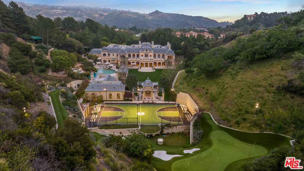 Presenting the premiere estate in North Beverly Park, the most exclusive gated community on the West Coast. 30,500 square feet with 12 bedrooms, 20 baths and set on an incredible 6.2 acres with unrivaled athletic facilities this Richard Landry designed chateau would be hard to duplicate today simply due to the lack of parcels this large. A spectacular 2-story entry lobby leads to the stunning living room, dining room and a breathtaking 2-story paneled library. The main level also includes an enormous kitchen/family room complex including pantries, a separate prep kitchen, and staff quarters and offices. The lower level holds an amazing home theater, professional gym, wine/cigar cellar and tasting/smoking lounge, the principal main level rooms all open to vast patios and lawns. The six acre grounds include manicured gardens, a 5 hole golf course, golf driving range, sports court, resort-like grotto pool, skate park, and guest house, all set amidst total privacy. Essentially this is your own private country club. Don't miss this once in a lifetime opportunity to acquire one of the great estates in Los Angeles. Shown to pre-qualified clients only.