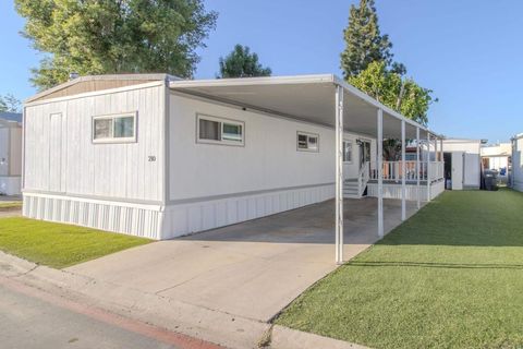 Photo of 10800 Woodside AVE #SPC 210, Santee, CA 92071 (MLS # 260010785SD)