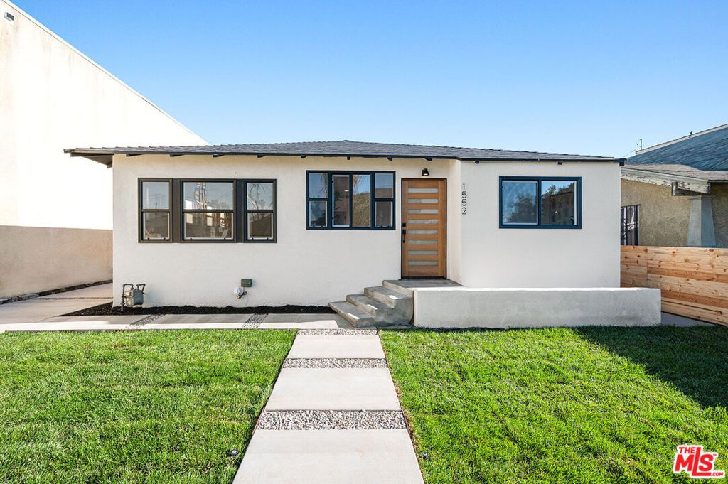 Photo of 1552 W Vernon Avenue, Los Angeles, CA 90062 (MLS # 24381393)