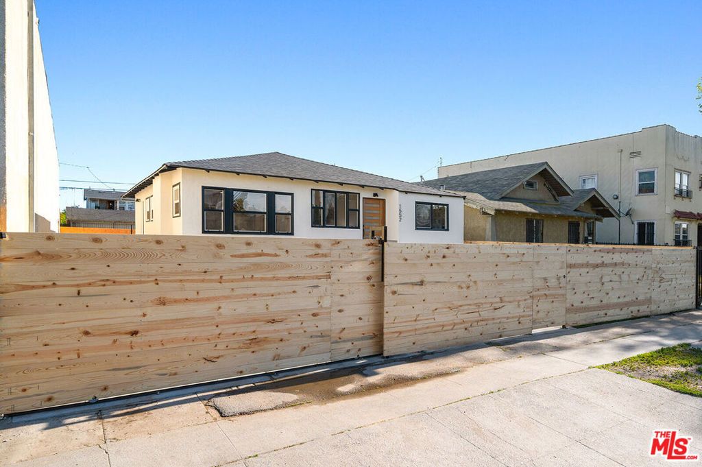 Photo of 1552 W Vernon Avenue, Los Angeles, CA 90062 (MLS # 24381393)