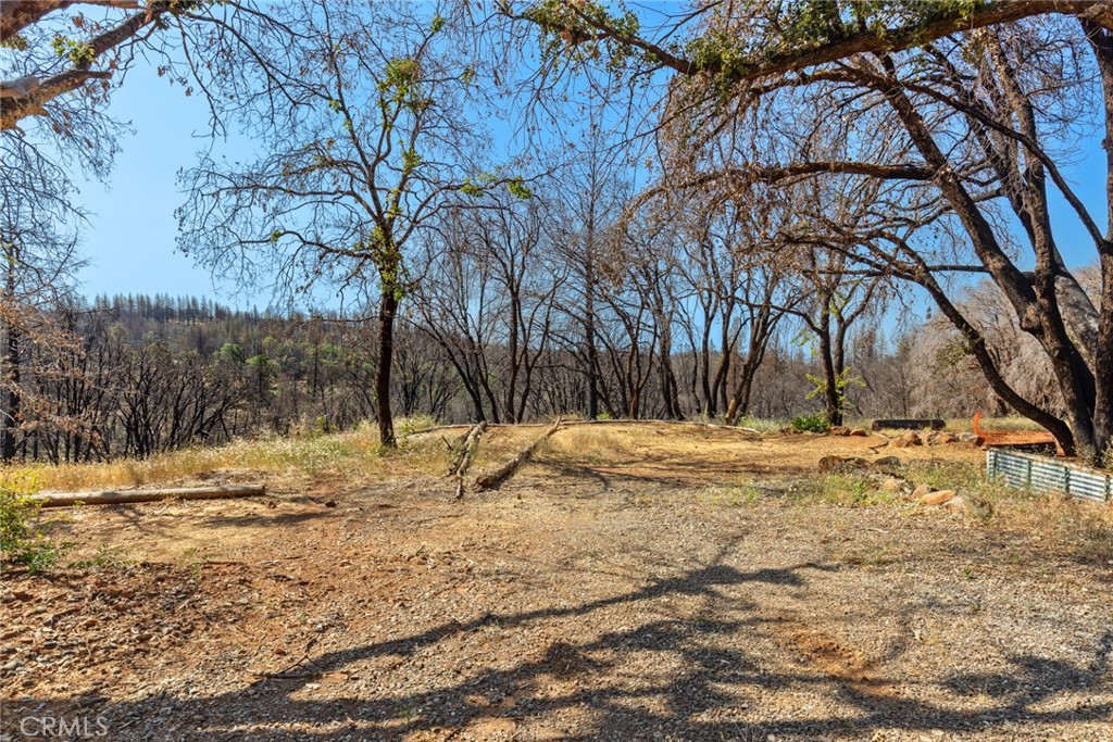 8.25 Acres in Cohasset – Ready for Your Vision! Don't miss this incredible opportunity to build your dream home in the peaceful community of Cohasset. This property offers a stunning valley view, privacy, tranquility, and endless possibilities. A previous 3-bedroom, 2-bath, 1,456 sq ft home once occupied the site. The well and septic system operate, providing a foundation to jumpstart your plans. With plenty of space for a custom mountain retreat, gardens, animals, or a hobby farm, the options are wide open. Whether you seek a full-time residence or a weekend getaway, this property offers the perfect setting to bring your vision to life.