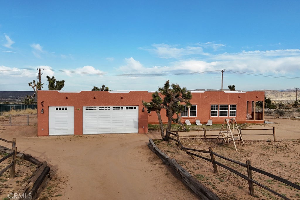 Welcome home in the serene enclave of Pioneertown, CA—a beautifully crafted single-family home offering a harmonious blend of modern luxury and rustic charm. This 1,300 square-foot residence features 3 spacious bedrooms and 2 elegantly bathrooms, providing ample space for comfort and relaxation.
The heart of the home is the open kitchen, boasting a sleek island with a cooktop, dishwasher, refrigerator, and pantry. Its bright and airy design is enhanced by recessed lighting and a skylight, perfectly complementing the dual pane windows with window treatments. The kitchen flows seamlessly into the formal dining room, ideal for entertaining guests.
Luxuriate in the primary ensuite, complete with a separate shower and a spa tub, offering a spa-like retreat within your home. Each bedroom is equipped with ceiling fans, large closets for generous storage space.
Step outside to your private patio, where you can unwind in the hot tub while enjoying the tranquil western exposure. The fenced front yard provides privacy and a safe space for outdoor activities.
This home not only includes central heating and air conditioning (new system in 2021) but also features a convenient laundry room with a washer and dryer. Additional amenities include an attached garage and on-site parking, adding to the convenience of this well-appointed home. New roof in 2022.
Fully furnished and ready for you to move in, 2559 Ox Yoke Pass is a perfect blend of comfort, style, and functionality in the heart of Rimrock. Pappy & Harriet's (legendary restaurant/venue) 8 min drive. Rimrock Ranch (wedding venue) 1 min drive. Burns Canyon Road Trailhead - 5 min drive(off roading trail that leads to Big Bear) Don't miss this opportunity to own a piece of paradise!