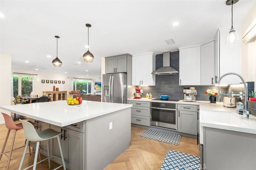 Nestled on a picturesque, tree-lined street in the heart of Southwood, this beautifully expanded and remodeled four bedroom, three bathroom single-family home offers nearly 2,110 square feet of stylish livable space - just over two miles from the beach and Redondo Pier.
A manicured front lawn welcomes you into an open-concept layout where the living room, dining area, and kitchen flow seamlessly together, ideal for everyday living and entertaining. The remodeled (2021) kitchen boasts quartz countertops, shaker cabinetry, a central island, modern appliances, and a walk-in pantry. A laundry room sits just off the kitchen for added convenience.
Surrounded by lush green plants, mature bushes, and trees, the home feels peaceful and private. Nearly every window on the main level looks out to vibrant greenery, bringing natural light and a sense of calm into every room.
The downstairs includes three bedrooms, a full bath, and a three-quarter bath toward the back of the home. Upstairs, the spacious and private primary suite offers an en-suite bath and charming neighborhood views.
The entertainer’s dream side yard includes an outdoor kitchen with a built-in barbecue, pizza oven, propane burner, sink, seating area, gorgeous imported granite countertop and a lemon tree. The backyard is a private retreat, featuring a grassy lawn, colorful flowers, an orange tree, and a play structure.
Almost doubled in size since 2021, the home includes modern upgrades: central A/C, newer roof, dual pane windows, water heater, wood flooring, recessed lighting & EV charger. The attached two-car garage offers great storage and versatility. Located near shopping, dining, Del Amo Mall, Torrance Memorial Hospital, and zoned for highly rated Torrance schools.
A rare Southwood opportunity—don’t miss it!