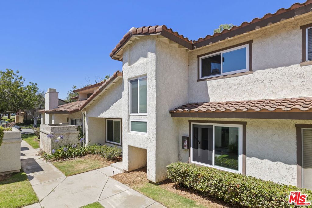 Welcome to Shangri-La... in this state of the art, light-filled, airy townhome just minutes from the beach! Meticulously remodeled and updated two-bedroom, two-bath gem. Soaring cathedral ceilings, rustic wooden beams and a central staircase featuring an expansive window and stunning pendant fixture... just a few of the architectural features which make this home truly unique. Beautiful luxury plank flooring, dual-pane Milgard windows, stainless steel appliances and remodeled baths finished with a designer's touch to create your peaceful sanctuary. Attached, oversized two-car garage provides storage space for all your toys, and a convenient laundry area. Relax on your private patio, take a dip in the pool, soak in the hot tub. Enjoy quiet, coastal community living. Perfectly turnkey and waiting for you.