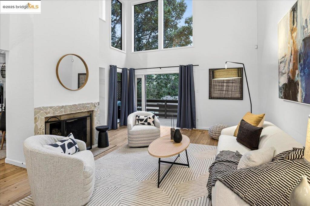 Nestled in a tranquil wooded setting, this coveted end unit Clarewood townhome blends comfort with timeless design. A semi-open floorplan with dramatic vaulted ceilings fills the living spaces with light, creating an airy atmosphere. With 3 bedrooms and 2.5 baths, the home offers flexibility for remote work, guests, or creative pursuits. Hardwood floors warm the main level, while a spacious deck invites morning coffee, relaxed evenings, or al fresco dining under the stars. An attached two-car garage provides secure parking and storage. Part of a close-knit community, residents enjoy a pool, clubhouse, and gathering spaces for potlucks and holiday celebrations. Just minutes from the Village Market, Terrace Café, and Broadway Terrace Nursery—with easy access to Highway 13 and Rockridge BART—this location balances hillside serenity with urban convenience. Nearby Rockridge, Montclair Village, and Lake Temescal trails add shopping, dining, and recreation. A rare opportunity to own a beautifully maintained home in one of Oakland’s most desirable enclaves—where easy living meets natural beauty.