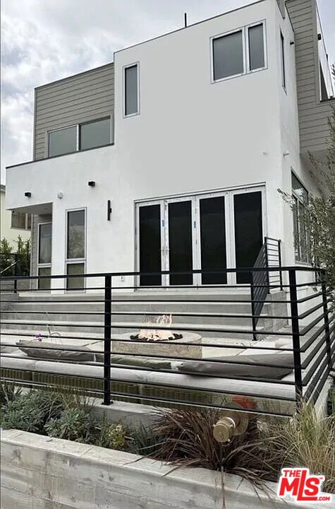 Welcome to a newly constructed three-story condo that perfectly combines modern elegance with everyday convenience. This bright and airy home features an open floor plan with expansive windows, flooding the space with natural light. The chef's kitchen, complete with a large island, state-of-the-art appliances, and a built-in guest bar, is ideal for cooking and entertaining. A private rooftop deck offers the perfect setting for outdoor gatherings or relaxing under the California sky. With dual entrances from the garage and a front entry, every detail is designed to enhance comfort and accessibility. Situated in the heart of Santa Monica, this home is just steps away from trendy shops, renowned restaurants, and Whole Foods Market. Iconic attractions like the Third Street Promenade and Santa Monica Beach are just minutes away, providing endless opportunities for entertainment and leisure. Located in an award-winning school district and close to top medical facilities, this exclusive condo delivers a lifestyle of ease and sophistication. With only three units in the complex, this is a rare opportunity to enjoy luxury living in one of Southern California's most desirable neighborhoods.