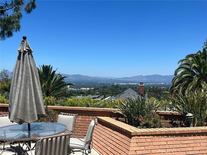 SOUTH OF VENTURA BLVD | VIEWS | LANAI SCHOOL DISTRICT | RECENTLY REMODELED WELCOME TO YOUR NEW DREAM HOME. Upon arrival you will be greeted by a beautiful private courtyard and pathway that leads to a bronzed double-door entrance and grand foyer which opens to an expansive, light and bright, single level open floor plan. Inside boasts custom windows, recessed lights, large formal dining room with custom ceilings, and eat-in kitchen that opens to family room. This home features brand new flooring throughout, brand new soft paint selection to compliment the original wood finishes. From the kitchen featuring newer appliances with an oversized island perfect for family gatherings to an open and adjacent living/family area with 180 degree views of the San Fernando Valley. The primary suite features expansive views, spacious walk in and accessory closets, and a patio with direct access to backyard. A few steps away is the expansive primary bath featuring a dual oversized vanity, spa-style shower, and direct patio access. The secondary bedrooms feature abundant natural lighting, ample closet space w/ organizers, district views, and much much more. Within close proximity is a spacious shared hall bath featuring an oversized vanity/mirror area, tub, and built in shower. This quiet oasis of a home is fitted with an attached laundry room w/ modern washer/dryer, generous storage and direct access to a large two-car garage (storage shelving included), and full bath for guest parallel to kitchen area. Making our way outside to your entertainers' dream backyard, 180-degree views with compliments of tree-lining and greenery, brick-lined spa, and plenty of square footage for family gatherings, special occasions, and much much more. SCHEDULE A TOUR TODAY, THIS HOME WILL NOT LAST!