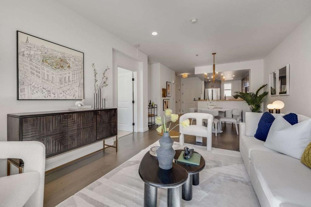 Perched on the top-floor corner of Candlestick Point, this sunlit 1BR/1BA condo feels like a private retreat above the city. Set in a gated community with 24-hr security, guest parking, and elevator access, it offers peace of mind and convenience. Wake up to bay views framed by high-end shutters before stepping into an open layout where the updated kitchen - refreshed cabinets, new hardware, stainless steel appliances, and gas cooktop - flows into the dining and living areas. Hardwood floors, recessed lighting, USB outlets, WiFi thermostat, fresh paint, and modern fixtures add style throughout. Enjoy quiet mornings or evenings on your private balcony with no upstairs neighbor. The spacious bedroom features dual walk-through closets leading to a refreshed bath with upgraded vanities. Community perks include secure garage parking, gym, dog-friendly lawn, and BBQ area, with bay trails nearby plus a free BART/Caltrain shuttle and Hwy 101 just minutes away.