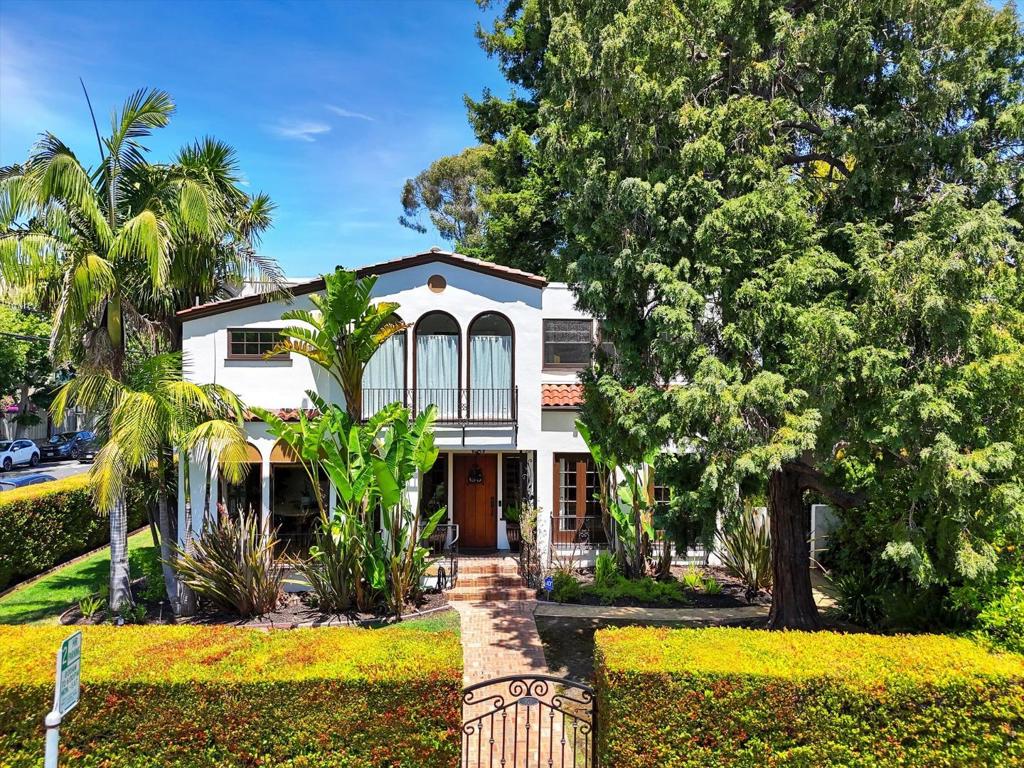 Nestled in the historically rich Glazenwood neighborhood of Hayward Park in San Mateo this property presents a unique opportunity to own a piece of local heritage. This captivating residence seamlessly blends classic charm with modern updates, set within a neighborhood steeped in the grandeur of early 20th-century. Upon entering, you are greeted by a foyer featuring a striking staircase with iron detailing. To the right, an elegant living room awaits, complete with a fireplace, sconce lighting, and convenient access to the expansive deck. The Kitchen is thoughtfully designed with panel-ready appliances integrated with surrounding cabinetry. Adjacent is a breakfast nook and window seat. A convenient bedroom and full bath are also located on this main level. Ascend the staircase to discover 4 generously sized bedrooms, each boasting ample natural light. The primary bedroom features a private en-suite bathroom, while two additional bedrooms share a convenient Jack-and-Jill access to the third full bathroom. The backyard is a tranquil escape with an outdoor fireplace and a comfortable lounge area. A charming Spanish balcony provides an elevated view of the surroundings. Exceptional functionality, low-maintenance turfed lawn and the significant bonus of RV/boat parking potential