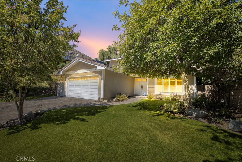 Absolutely stunning home located in the highly sought-after Castle Peak Estates and the award-winning Las Virgenes School District. This beautifully updated home sits on a quite cul-de-sac and boasts an incredible curb appeal. The inviting double-door entry opens to a spacious living room with picture windows, a large formal dining room, engineered wood flooring, and convenient powder room. The remodeled gourmet kitchen features granite counters, custom tile back splash, stainless steel appliances, and a breakfast bar that flows seamlessly in to an expansive family room with a cozy fireplace, wet bar, built-in cabinetry, and elegant travertine tile flooring. Recessed lighting enhances the modern feel throughout. step outside to your private, park-like back yard-an entertainer's dream. Enjoy lush landscaping, a Newley installed custom brick patio, pergola, and an outdoor dining area with lighting to create the perfect ambiance for gatherings. Upstairs, the spacious primary suite offers a remodeled En-suite bathroom with dual sinks, a large shower, and an oversized walk-in closet. Two additional bedrooms share a remodeled hallway bathroom with dual sinks and tub. The upstairs hall way also includes custom engineered wood flooring and built-in cabinetry for extra storage. Ideally located close to shops, parks, hiking trails, The Village, Topanga Westfield Mall, Costco, Calabasas Commons, all trendy restaurants, and easy freeway access.