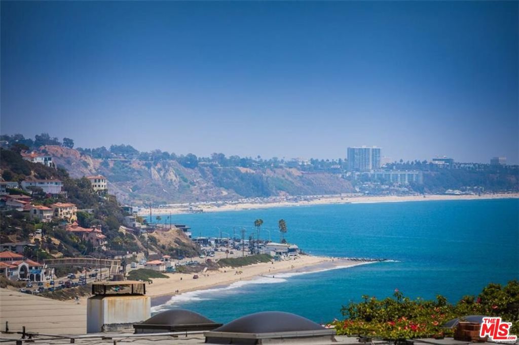 Stunning modern view property! This is your chance to live in Malibu off Coastline Drive with sweeping, stunning views of the Pacific Ocean and the Queen's Necklace. 180 degree panoramic views from the balcony and master bedroom of the Villa de Leon, Santa Monica, Malibu, the ocean and the beaches. This 2BD/2BA is very open, offers plenty of great natural light and flows smoothly throughout. French oak floors line the entire unit with freshly updated tiled bathroom floors. Oversized white quartz kitchen counters and newer stainless-steel appliances, open to the dining area making it perfect for entertaining. Newer kitchen cabinets along with new hardware. Newer windows and sunken living room slider, built-in closets in both bedrooms and the washer/dryer has been brought into the unit! This property will not last! Just minutes to Santa Monica, Malibu and the city! A short walk over to the Getty Villa or across the street and your toes are in the sand! This is your chance to live in Malibu and wake up every day to some of the best views around!