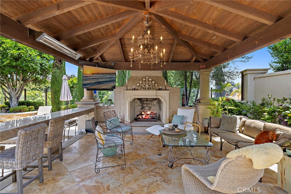 Welcome to your dream home at 6 Belcrest, nestled in the serene, guard-gated community of Crest de Ville. This exquisite residence offers an expansive 4,195 square feet of living space, artfully designed and completely remodeled in 2019 to provide both luxury and comfort.
Step inside to discover a generously sized home featuring 5 bedrooms and 4 elegantly renovated bathrooms. The heart of the home is its chef's kitchen, complete with soapstone and quartz countertops, double ovens, a gas stove, and a walk-in pantry, making it perfect for culinary enthusiasts. A spacious eat-in kitchen with a breakfast bar adds to the charm, catering to both everyday meals and entertaining guests.
The living areas are bathed in natural light, accentuated by skylights and recessed lighting, while the Eastern exposure ensures warm, inviting mornings. The primary ensuite is a sanctuary of relaxation, featuring a steam shower, a separate tub, a towel warming drawer, and complemented by custom cabinetry.
For those looking for the ideal California living experience, the backyard/garden area provides the perfect haven for indoor/outdoor living. This beautiful space is perfect for outdoor gatherings with a beautifully landscaped private yard, complete with an outdoor living room, a pool, spa, and a BBQ area. The home office provides a quiet and productive environment for those working from home. Stay active in the home gym or enjoy leisure time in the second-floor media room/family room.
Enhanced with modern amenities, this "smart" home has undergone a total renovation, ensuring a blend of modern conveniences and timeless elegance. Embrace the opportunity to own this beautifully appointed home, offering the perfect blend of luxury and functionality.