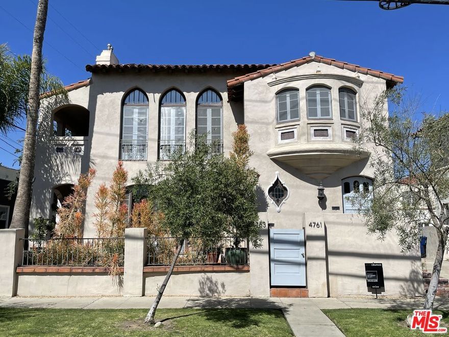 A rare opportunity in Hancock Park / Miracle Mile, this grand Mediterranean duplex offers nearly 4,700 sq ft of beautifully maintained living space across two expansive 3-bed, 3-bath residences - each delivering the scale and feel of a private single-family home. The remodeled lower unit (approx. 2,200+ sq ft) features stainless steel appliances, private laundry with high-end machines, central AC/heat, ceiling fans, hardwood floors, a gas fireplace, oversized windows, formal dining room, breakfast room, and a private furnished patio. The sun-filled renovated upper unit (approx. 2,300+ sq ft) showcases stunning Spanish-Modern character with hardwood floors, recessed lighting, French windows, stained-glass accents, a living room fireplace, custom built-ins, and an updated gourmet kitchen with a grand dining room and office/den. Both units offer abundant natural light, quality craftsmanship, modern systems, EV chargers for each unit, and access to a 2-car garage. The property is fully occupied with month-to-month tenancy, generating $5,300/month from the upper unit and $4,400/month from the lower unit - providing strong in-place income with flexibility for an owner-user or investor. Offered at $2,095,000, the property reflects an approximate 18 GRM and ~5.56% gross cap rate based on current income, consistent with typical Hancock Park / Miracle Mile duplex performance. With rare architectural character, walkability, upside potential in future rents, and a meticulously maintained owner-occupied condition, this is an exceptional opportunity in a prime central Los Angeles location. Financial metrics are based on current gross income only; operating expenses not included. Buyer to independently verify all information. Showings allowed with accepted offer only. Do not disturb tenants.