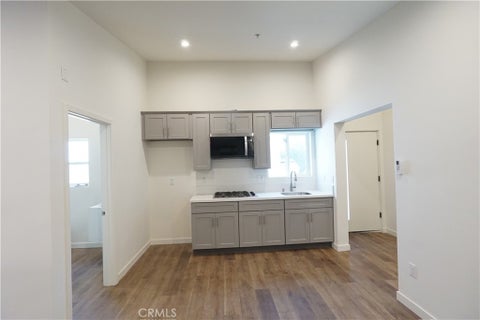 Photo of 2821 8th 1/2 Avenue, Los Angeles, CA 90018 (MLS # SR26219713)