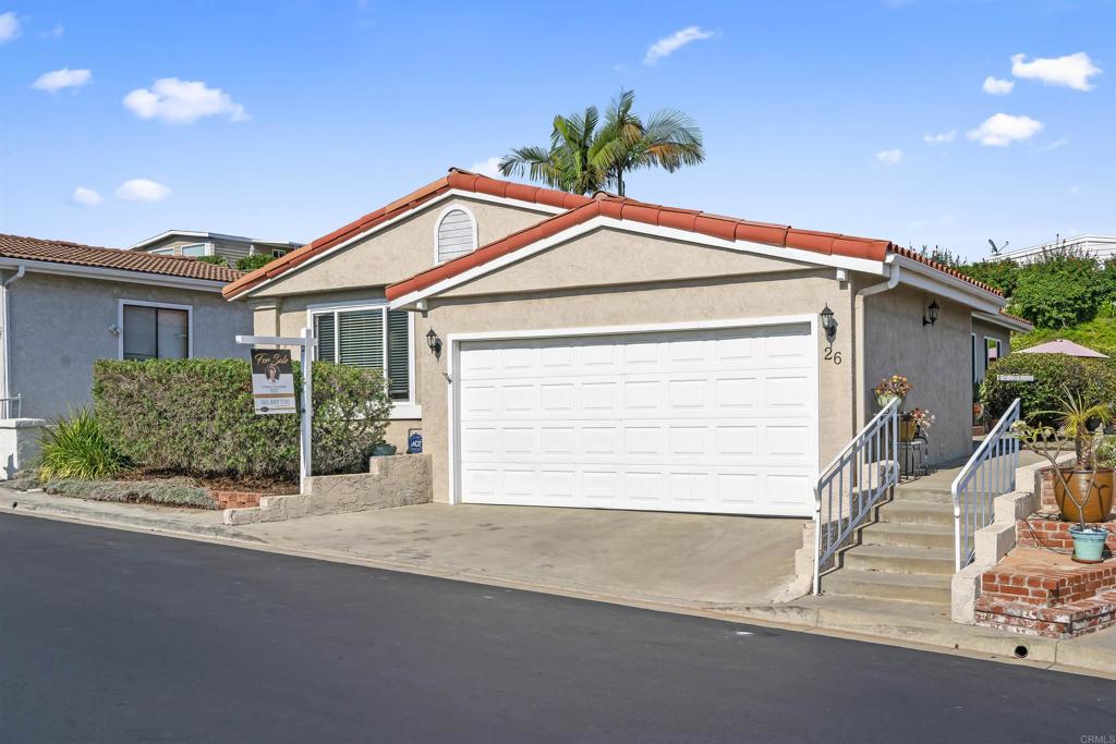 Charming remodel! Bamboo floors that open to an open floorplan where you can cozy around the fireplace* Dual pane windows bring in natural light*remodeled kitchen cabinets, counters, stainless appliances*2 bedroom 2 bath 2 car garage* This home has it all* French doors open to a gorgeous garden feels like a resort! Beautifully remodeled primary bath and secondary*Custom window treatments*OWN THE LAND*quiet location*Pride of ownership just charming!