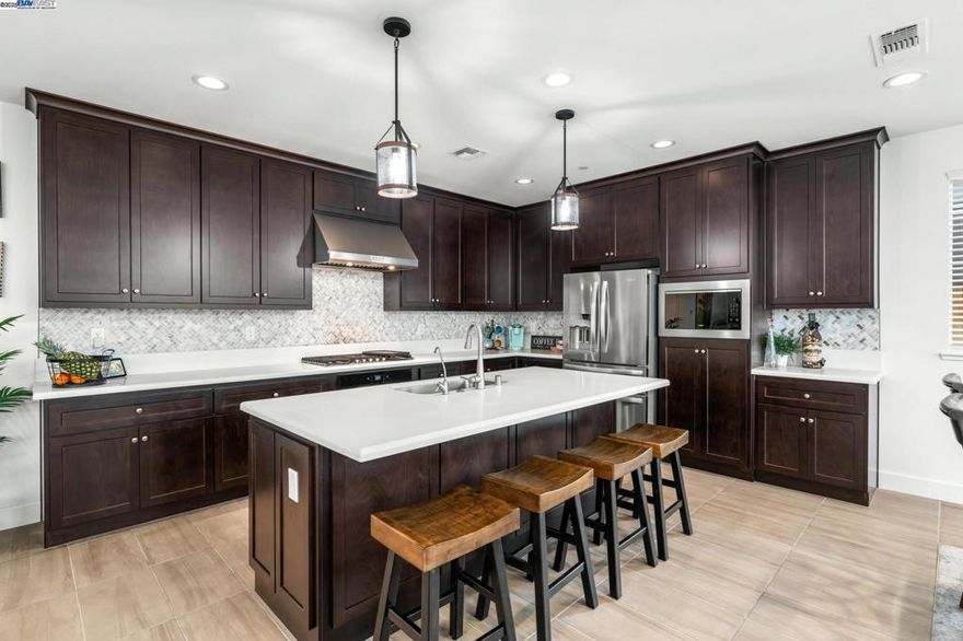 Introducing an exceptional newly built residence completed in 2024, blending modern design with timeless elegance. This two-story home offers 3 bedrooms and 2.5 bath, thoughtfully crafted to provide both comfort and sophistication.  Step inside to discover elegant tile flooring, newly installed laminate flooring and custom wood blinds that enhance the home’s contemporary style. The gourmet kitchen is equipped with premium stainless steel appliances, designed for both everyday living and entertaining.  Sustainability meets convenience with a fully paid solar system and a water softener, ensuring efficiency and peace of mind. The residence extends seamlessly to the outdoors with a private back patio, ideal for dining or relaxation.  Perfectly situated with quick access to Hwy 580, this home offers an effortless commute while maintaining the comfort of a serene retreat.  This is more than a home—it’s a statement of quality and modern living. Schedule your private tour today before this opportunity passes.