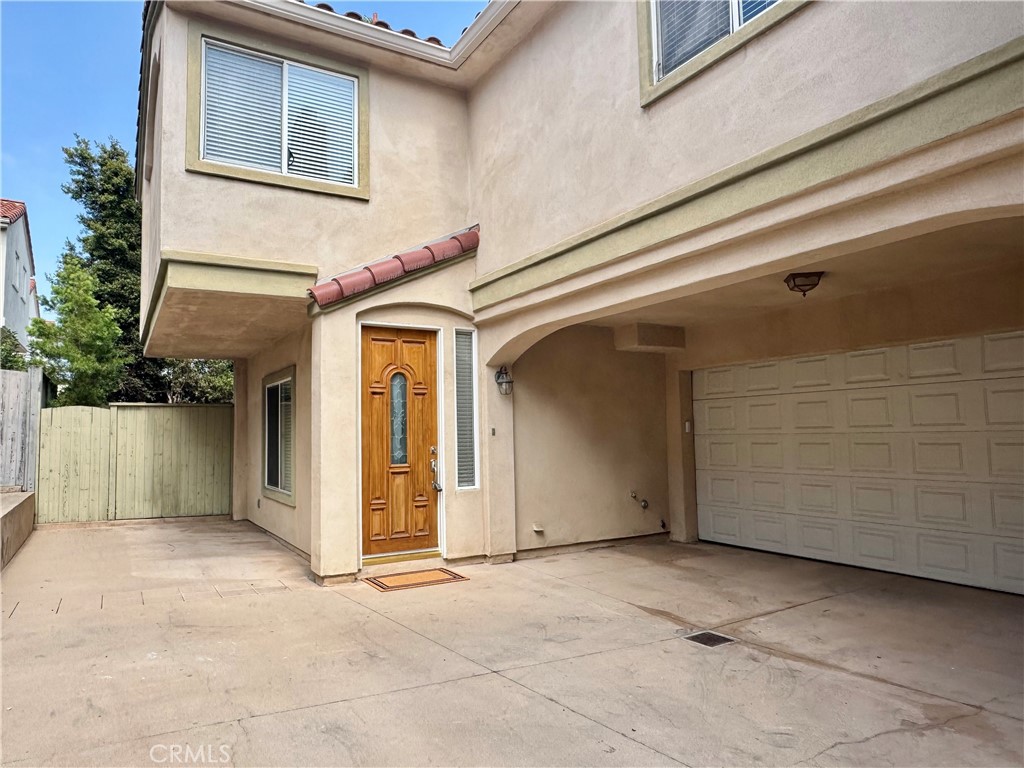 Welcome to this stunning and meticulously maintained 3-bedroom, 2.5-bath back-unit home offering the perfect blend of style, comfort, and coastal living. This freshly updated townhome features an open and inviting floor plan filled with natural light. The spacious living room with a cozy gas fireplace opens to a dining area and a gourmet kitchen with granite countertops, stainless steel appliances—including a gas range, microwave, refrigerator, and new dishwasher—ideal for the home chef. Step outside to your private backyard retreat with a patio and low-maintenance garden space, perfect for relaxing or entertaining. Upstairs, you’ll find a large family room with fireplace, a primary suite with fireplace and sitting area, whirlpool tub, separate shower, and walk-in closet. Two additional bedrooms (one with its own walk-in closet) share a full bath, and the convenient upstairs laundry includes a washer and dryer. Enjoy modern upgrades throughout: new tankless water heater, new whole-house water filtration system, security system, fresh paint, new roof, and a two-car attached garage with direct access. Located close to top-rated schools, parks, shopping, and just a short drive to the beach — this home in a desirable family-friendly neighborhood offers the best of relaxed coastal living with every modern convenience.