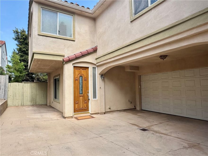 Welcome to this stunning and meticulously maintained 3-bedroom, 2.5-bath back-unit home offering the perfect blend of style, comfort, and coastal living. This freshly updated townhome features an open and inviting floor plan filled with natural light. The spacious living room with a cozy gas fireplace opens to a dining area and a gourmet kitchen with granite countertops, stainless steel appliances—including a gas range, microwave, refrigerator, and new dishwasher—ideal for the home chef. Step outside to your private backyard retreat with a patio and low-maintenance garden space, perfect for relaxing or entertaining. Upstairs, you’ll find a large family room with fireplace, a primary suite with fireplace and sitting area, whirlpool tub, separate shower, and walk-in closet. Two additional bedrooms (one with its own walk-in closet) share a full bath, and the convenient upstairs laundry includes a washer and dryer. Enjoy modern upgrades throughout: new tankless water heater, new whole-house water filtration system, security system, fresh paint, new roof, and a two-car attached garage with direct access. Located close to top-rated schools, parks, shopping, and just a short drive to the beach — this home in a desirable family-friendly neighborhood offers the best of relaxed coastal living with every modern convenience.